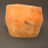 Calcite orange, tea light holder rough stone with polished top