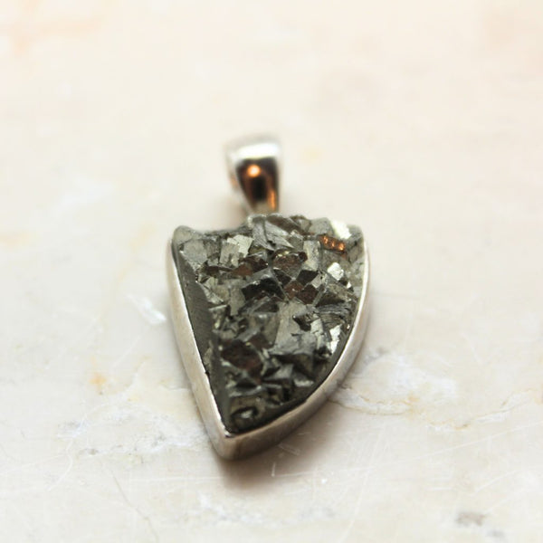 Pyrite cluster in silver pendant