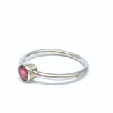 Garnet, oval lying stone in silver ring