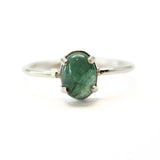 Emerald, claw-set oval emerald in silver setting