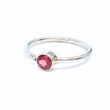 Garnet, oval lying stone in silver ring