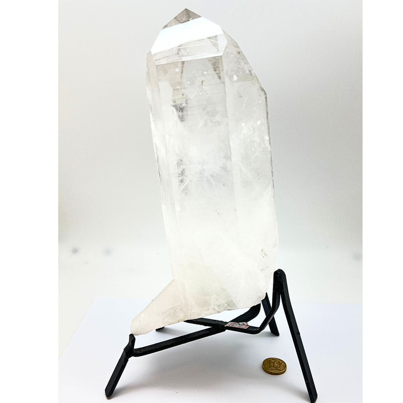 Large natural rock crystal tip in stand