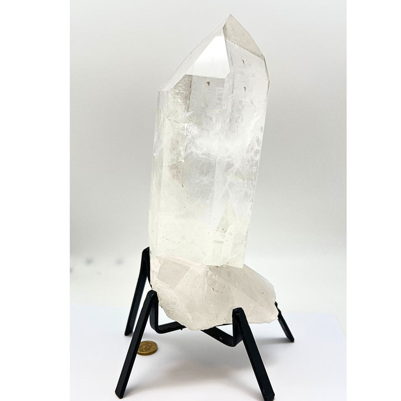 Large natural rock crystal tip in stand