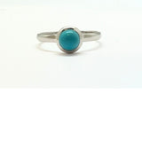 Turquoise round stone in sterling silver