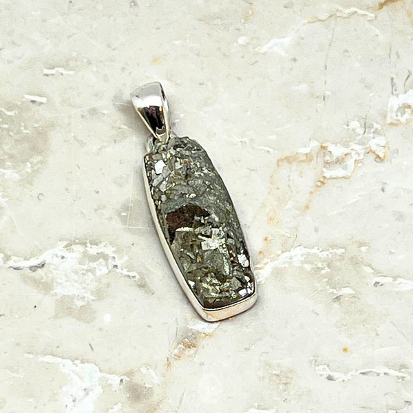 Pyrite cluster in silver pendant