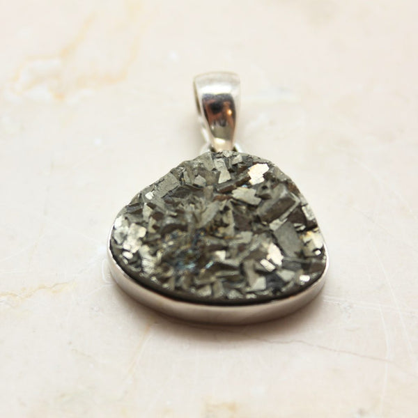 Pyrite cluster in silver pendant