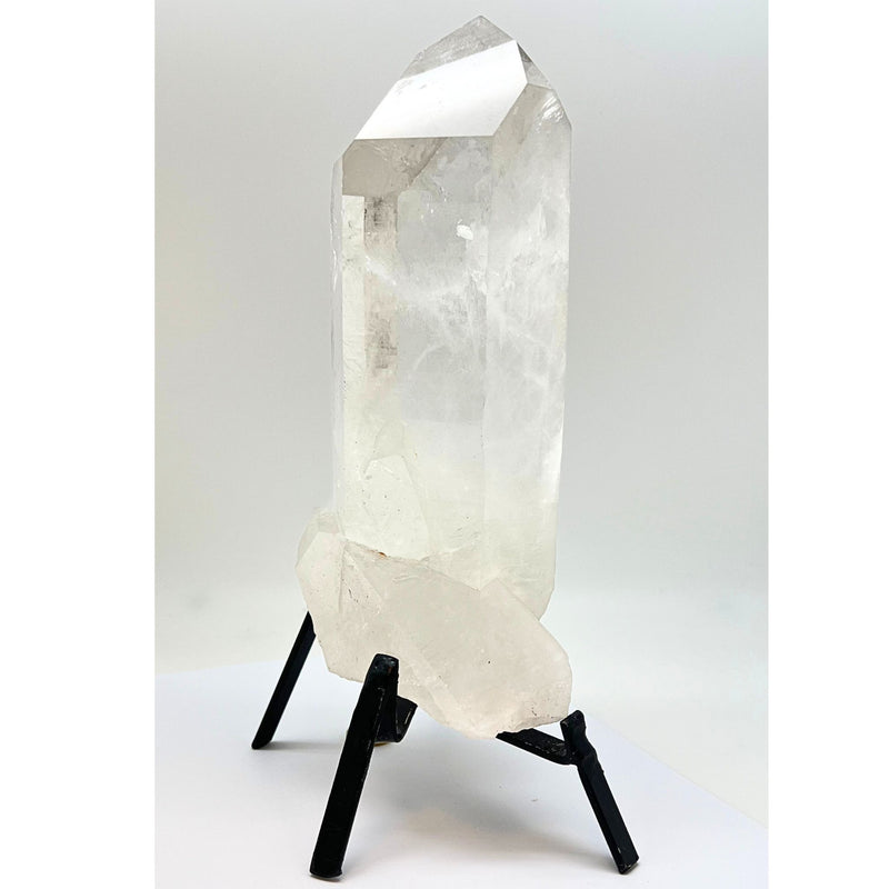 Large natural rock crystal tip in stand