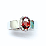 Garnet, oval lying stone in silver ring