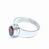 Garnet, oval lying stone in silver ring