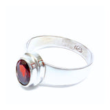 Garnet, oval lying stone in silver ring
