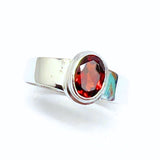 Garnet, oval lying stone in silver ring
