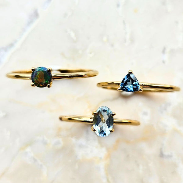 Blue topaz triangular faceted stone in gold plated silver ring