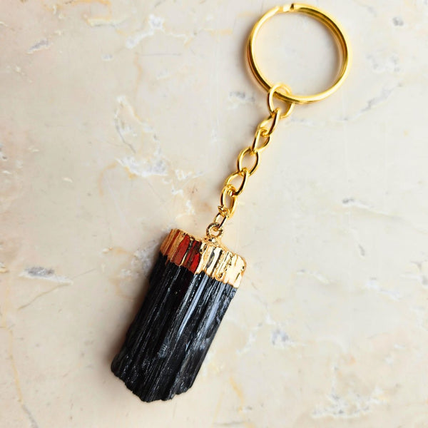 Tourmaline tip gold colored key ring