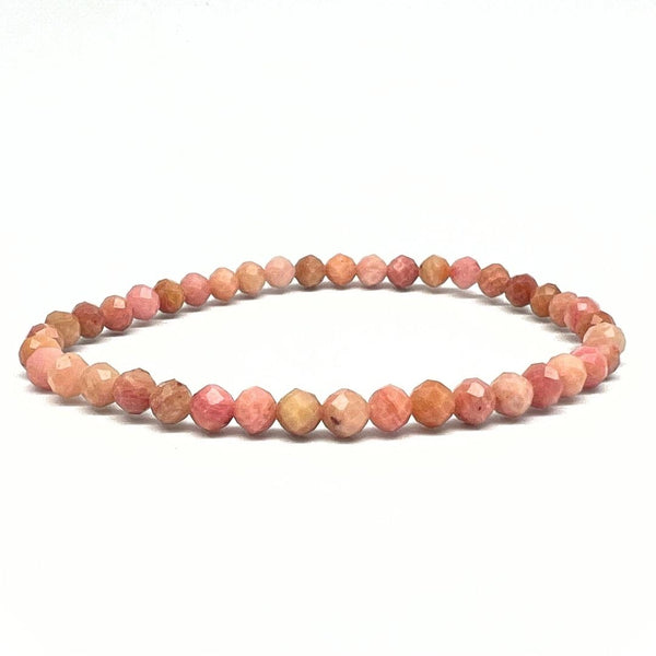 Förstenat trä, rosa fasettslipat armband 4 mm