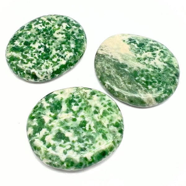 Jade, green-speckled polished slab