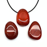 Karneol, trumlat hänge med hål