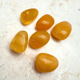 Calcite orange, tumbled AA quality