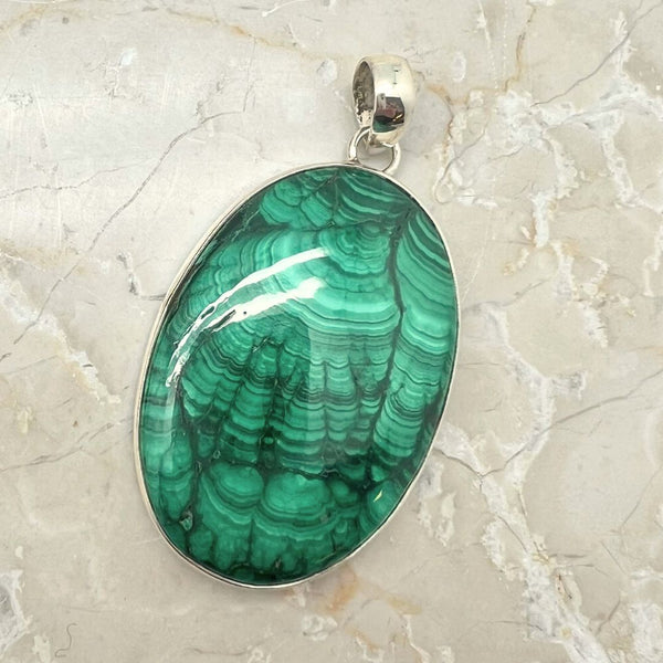 Malachite silver pendant with silver edge