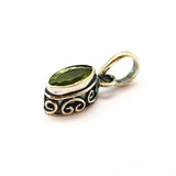 Peridot, pendant in ellipse silver filigree