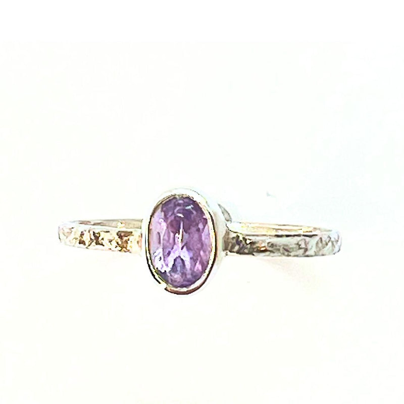 Amethyst faceted stone in silver ring