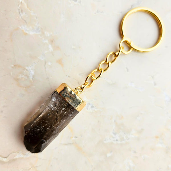 Smoky quartz point gold colored key ring