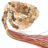 Månsten mala med 6 mm pärlor, sidentofs och brokadpåse