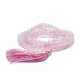 Rose quartz grind with 8 mm beads, silk tassel and brocade bag