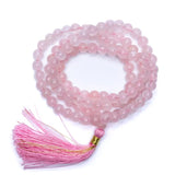 Rose quartz grind with 8 mm beads, silk tassel and brocade bag