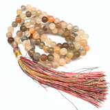 Månsten mala med 6 mm pärlor, sidentofs och brokadpåse