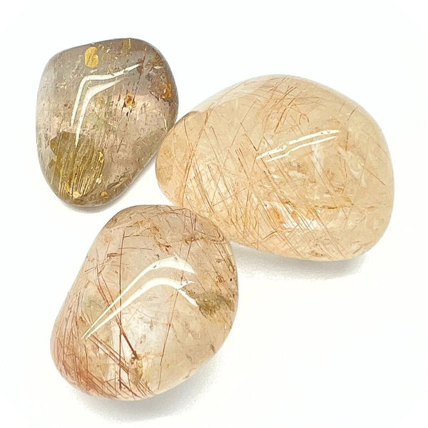 Rutile quartz, tumbled stone