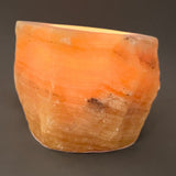 Calcite orange, tea light holder rough stone with polished top