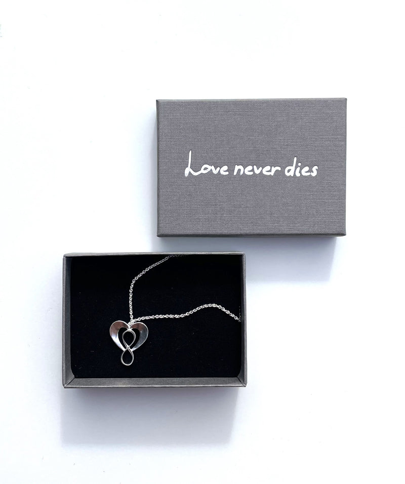 Pendant "Love never dies" in silver