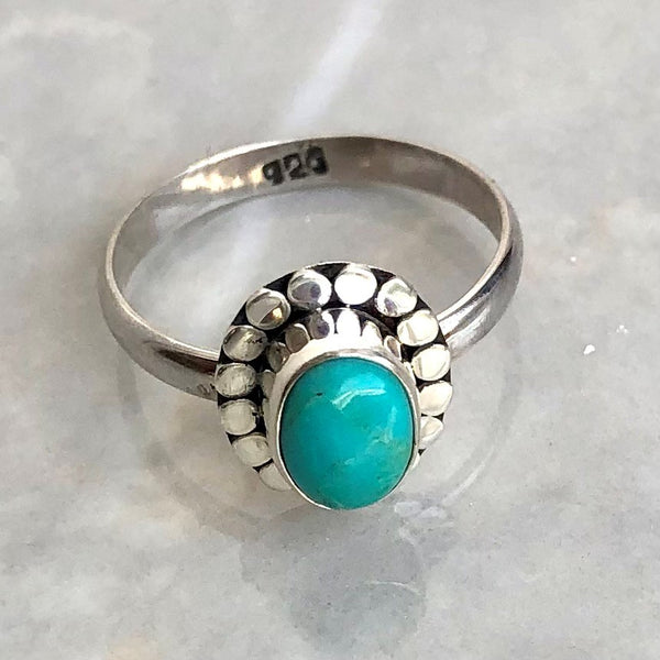 Turquoise, oval stone in silver filigree