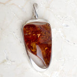 Amber pendants cognac color and silver