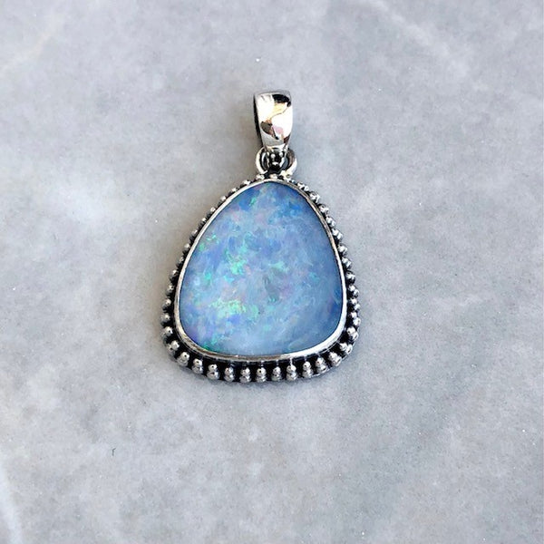 Opal large pendant with irregular filigree