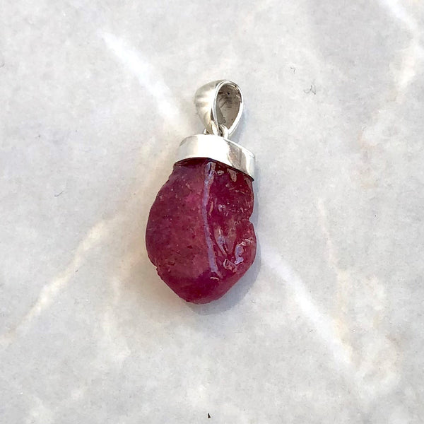 Ruby with natural rod shape in silver
