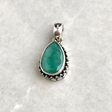 Emerald, drop-shaped pendant with silver filigree