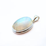 Rainbow moonstone, small oval pendant in plain silver