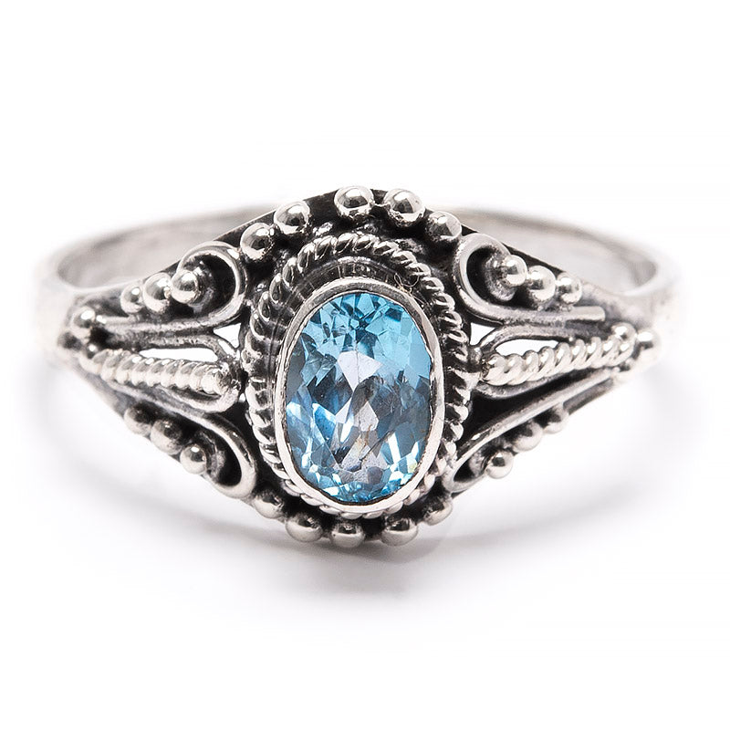 Topaz blue, in silver ring with filigree