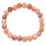 Kuukivi, oranssi rannekoru, pyöreät helmet 8mm