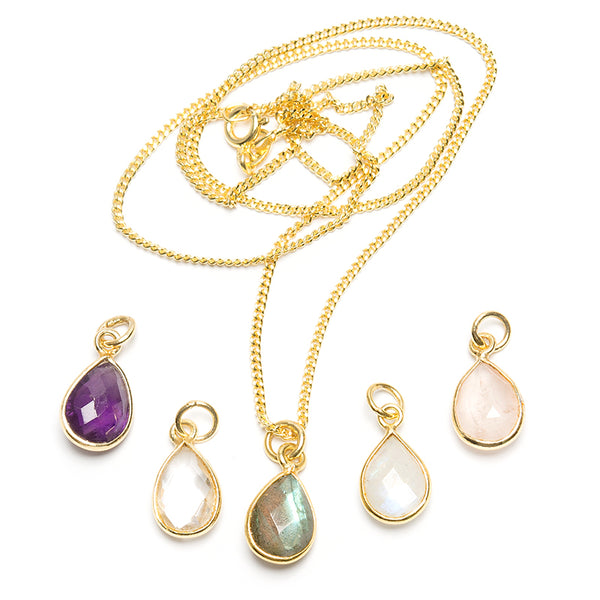 Several different pendants, faceted drop in gold-plated silver
