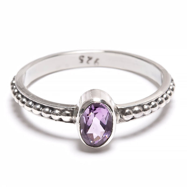 Amethyst faceted stone in silver ring