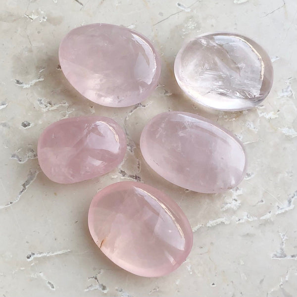 Rose quartz cut amulet shape