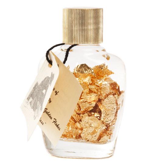 Gold flakes in a small bottle