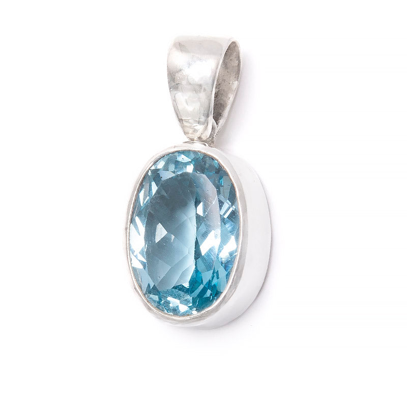 Blue topaz pendant slightly larger stone in a stylish silver setting