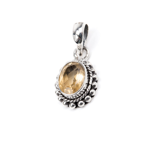 Citrine, silver pendant with oval faceted stone in filigree border