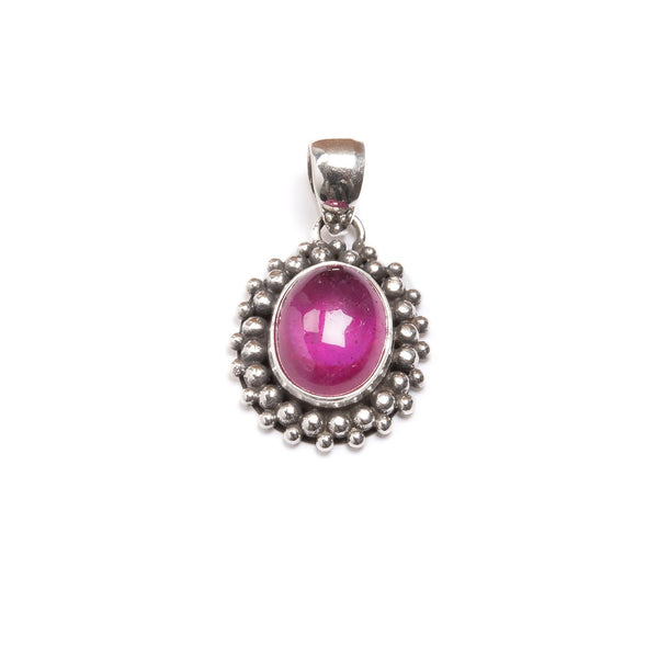 Ruby in pendant with filigree decoration